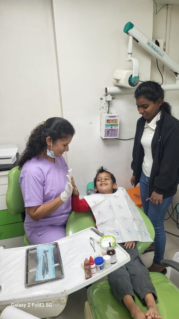 Dr. Madhuri Bhandari treating a child patient at her dental clinic in Pimpri Chinchwad Pune